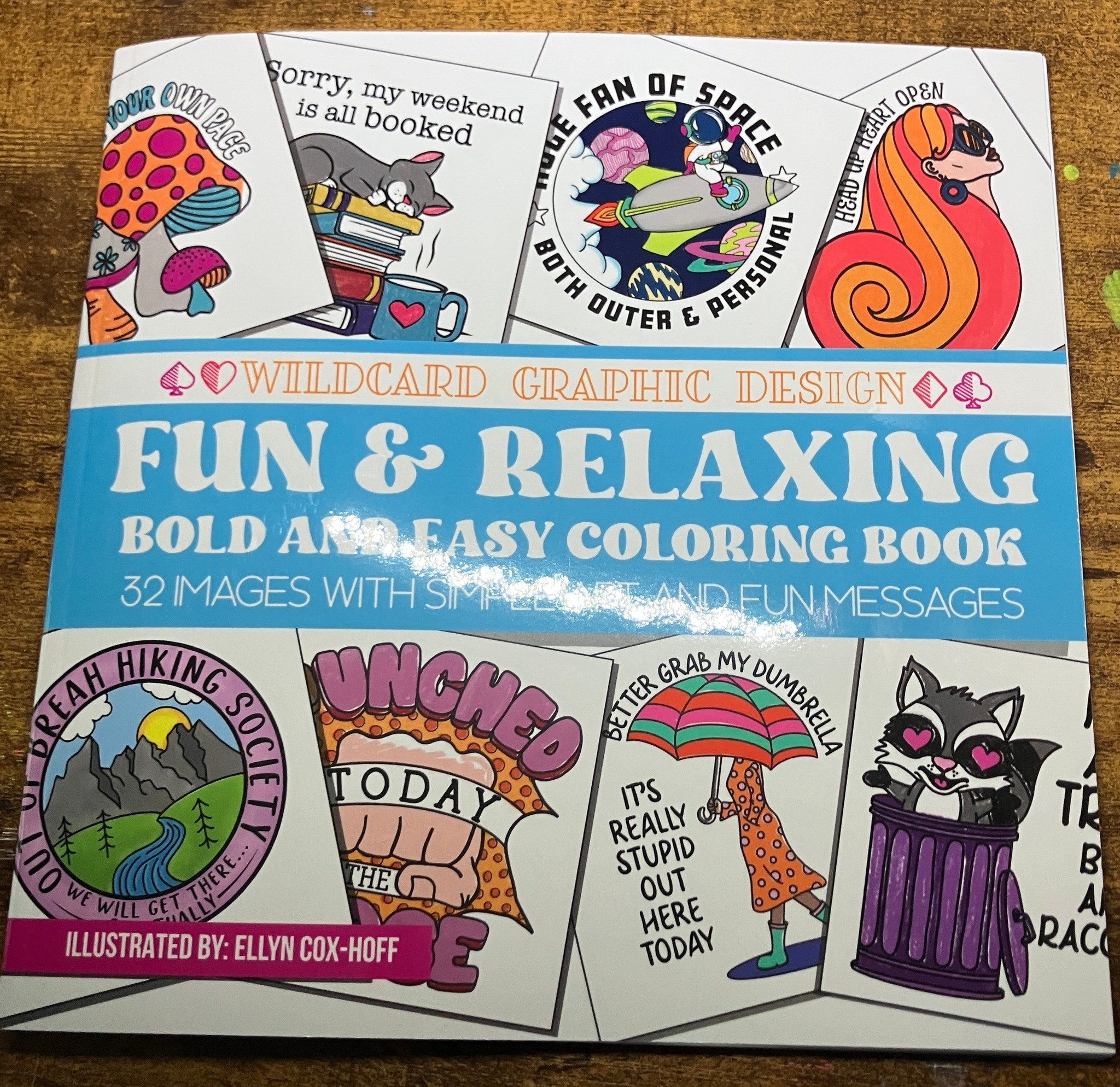 Colorful comic-style illustrations of animals, people, and outdoor scenes on a fun coloring book cover, with a blue banner and text.