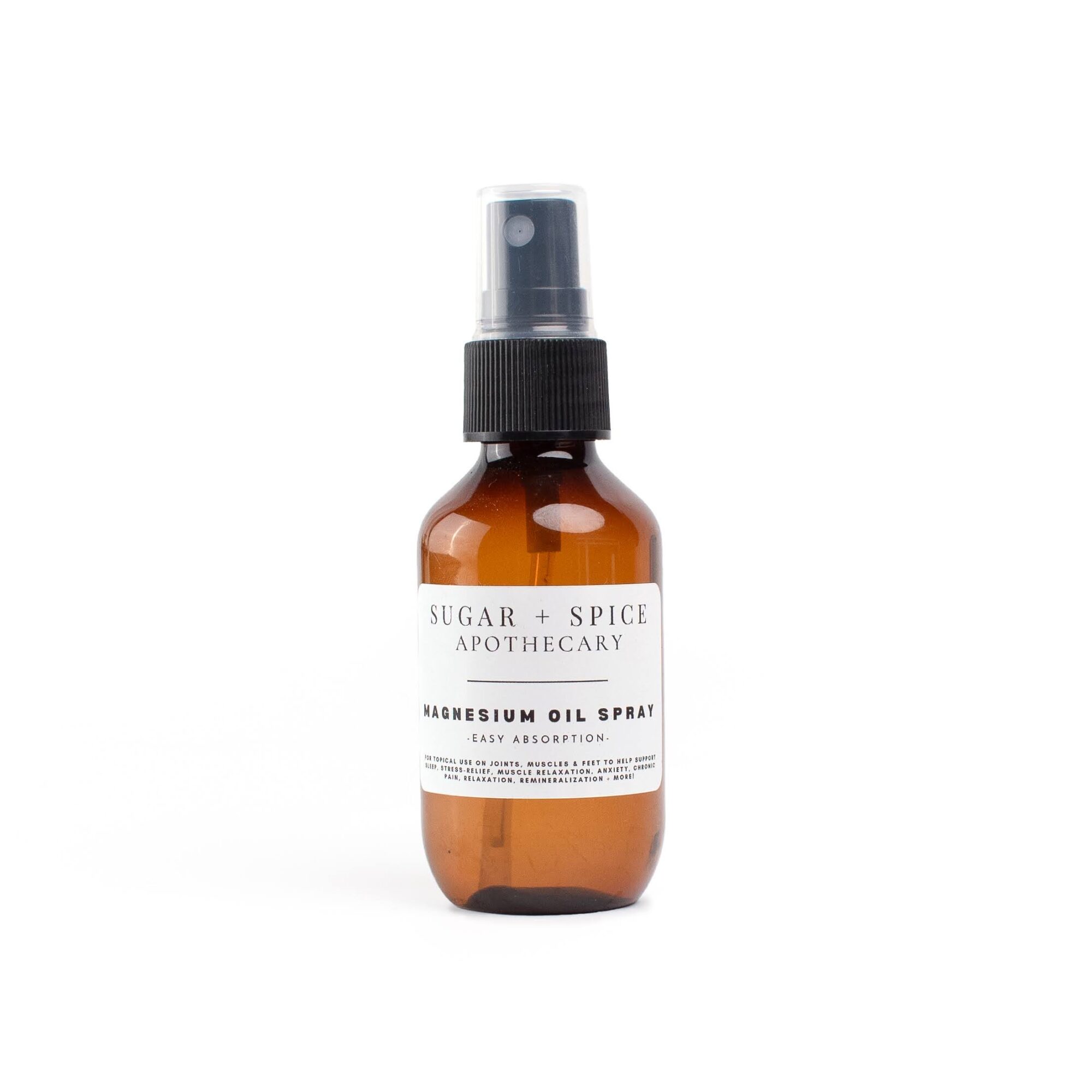 Amber glass spray bottle with a black spray nozzle and a white label, labeled 'Sugar + Spice Apothecary' and 'Kadrosem Oil Spray'.