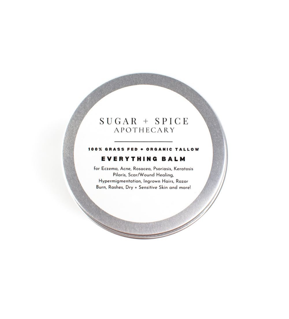 Round container with a white label reading 'Sugar + Spice Apothecary' and product details, on a white background.