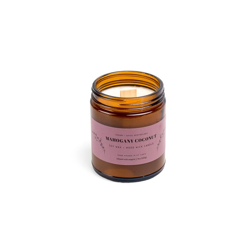 Open amber glass jar with pink label, no lid, on white background.