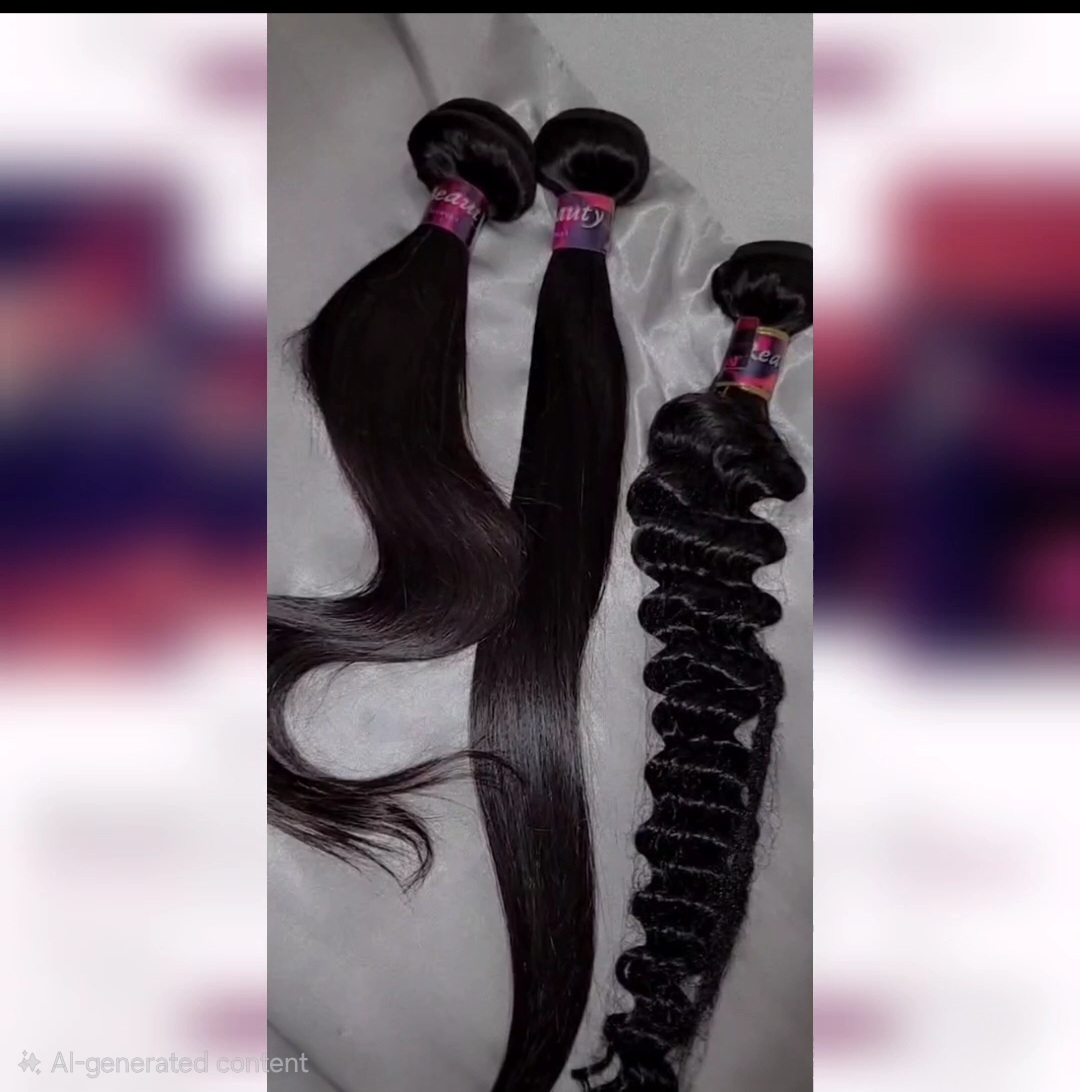 Two bundles of black hair extensions, one straight and one curly, placed on a light-colored surface.