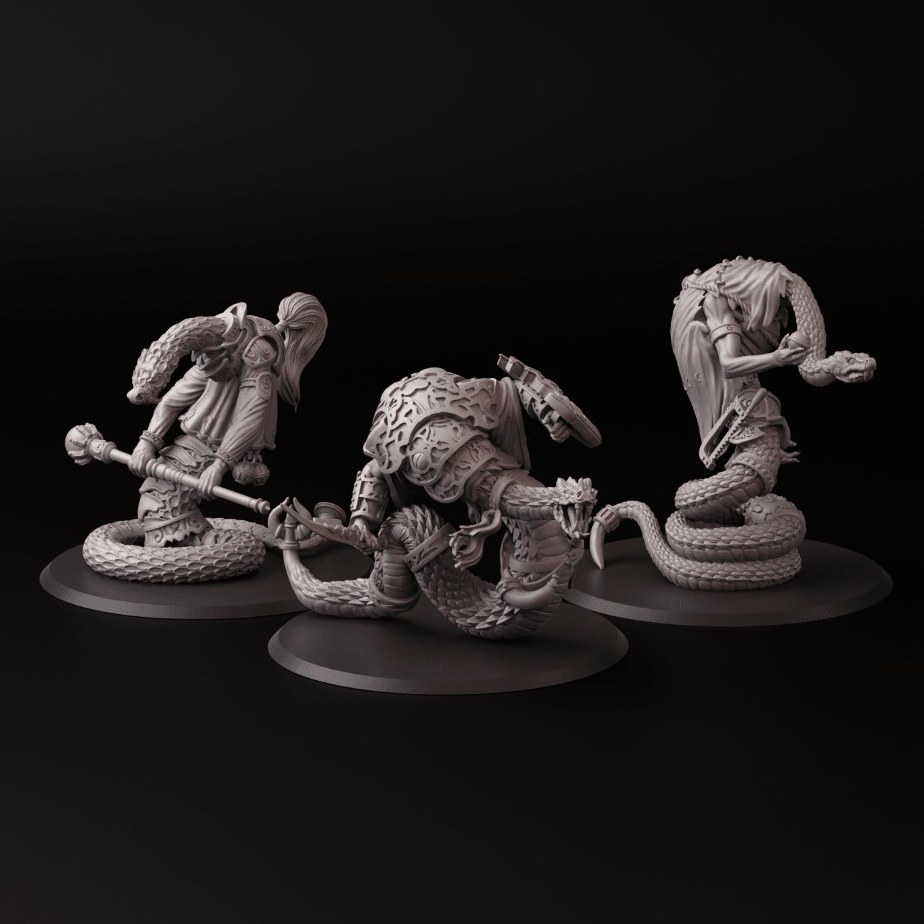 Three detailed fantasy creature miniatures on black bases, with one resembling a humanoid with armor, another a tentacled beast, and a third a humanoid with a weapon.