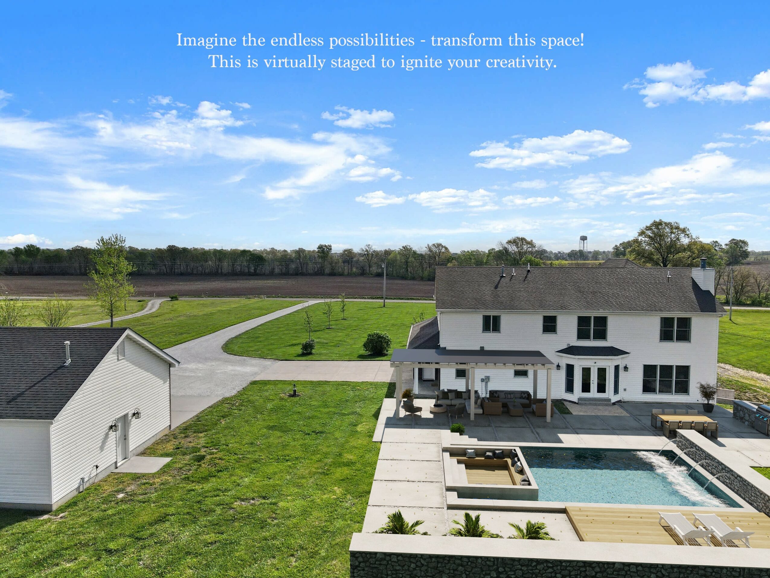 A white house with a backyard pool, surrounded by green grass and a driveway, under a blue sky with clouds.