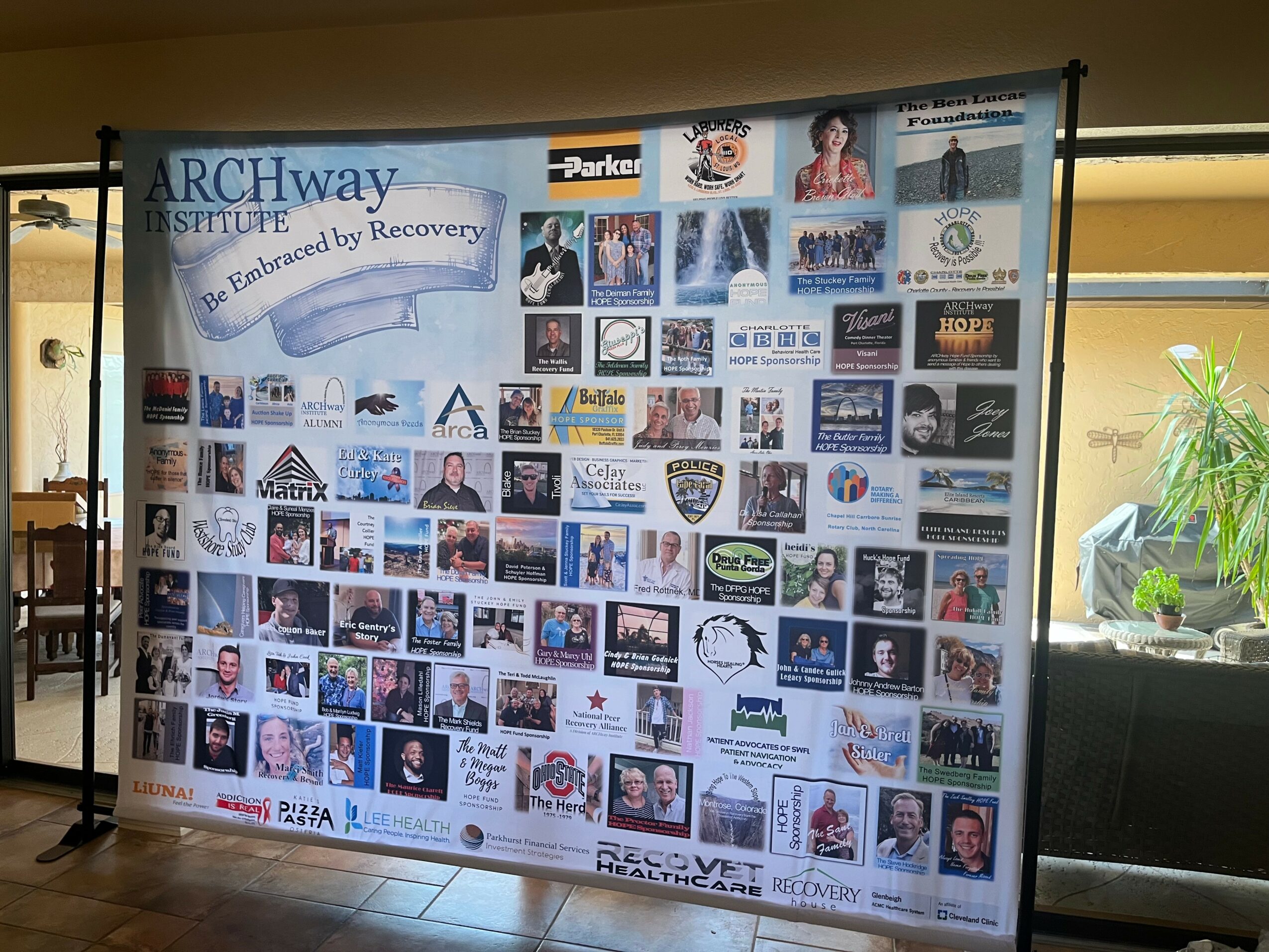 Large poster with many images and text, including a blue banner with 'ARCHway' and various logos and photos.