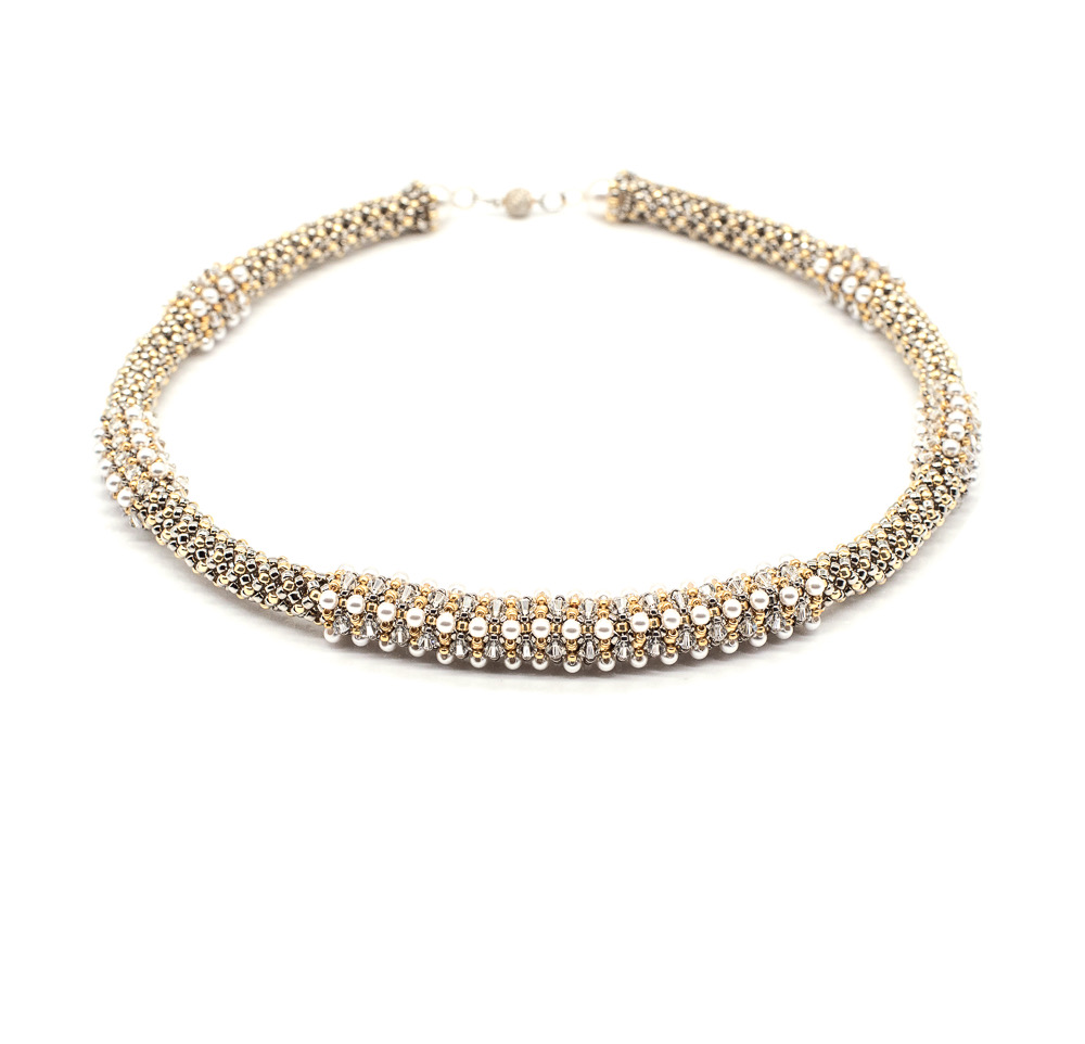 A sparkling, multi-strand rhinestone necklace with a clasp, displayed against a white background.