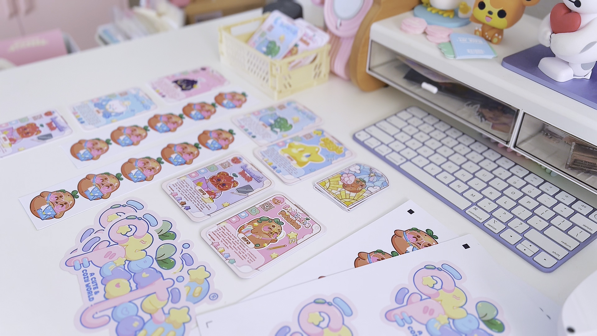 Colorful stickers and stationery on a desk with a keyboard and organized supplies.