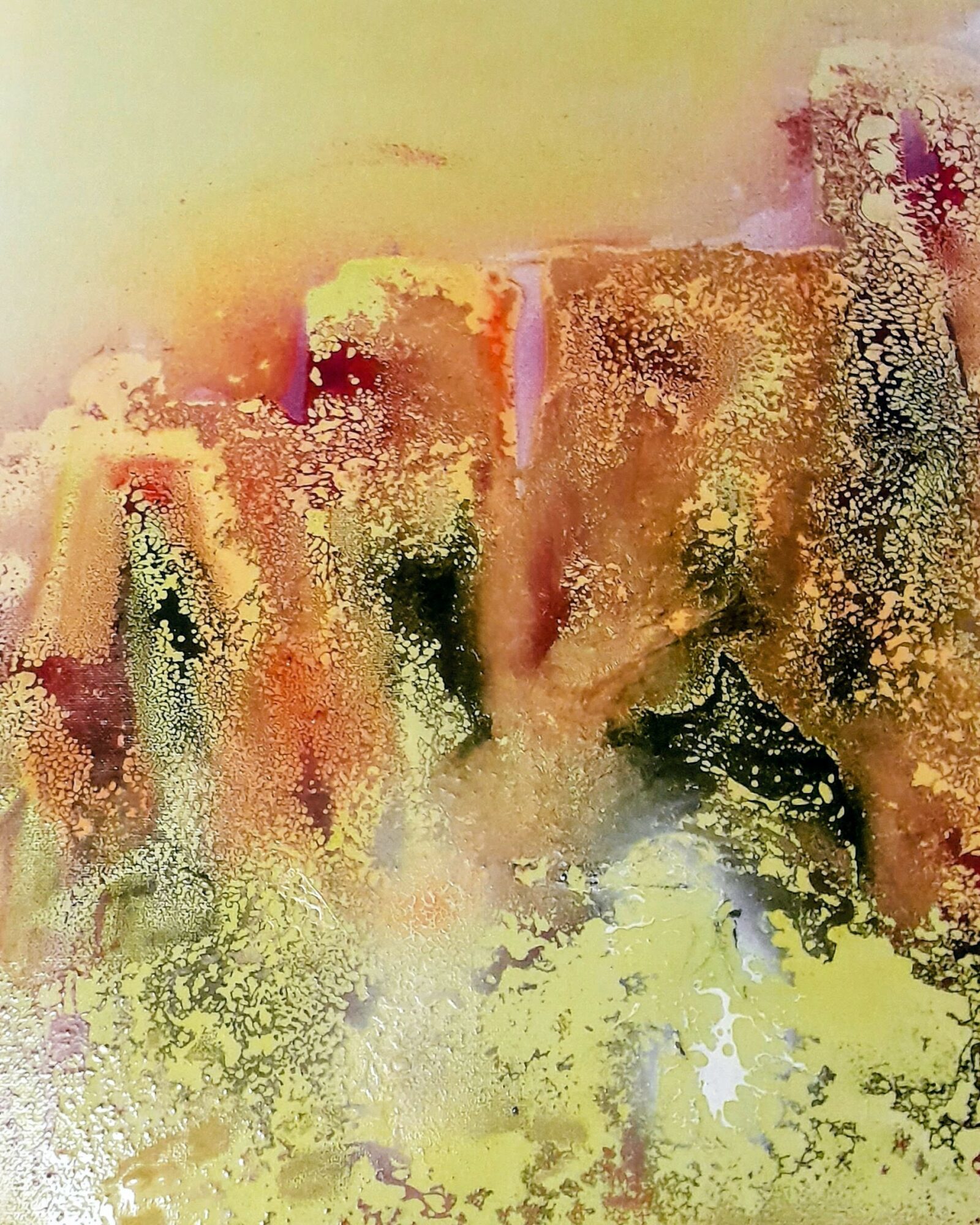 Abstract painting with warm colors, textured gold and black accents, and a soft yellow background.
