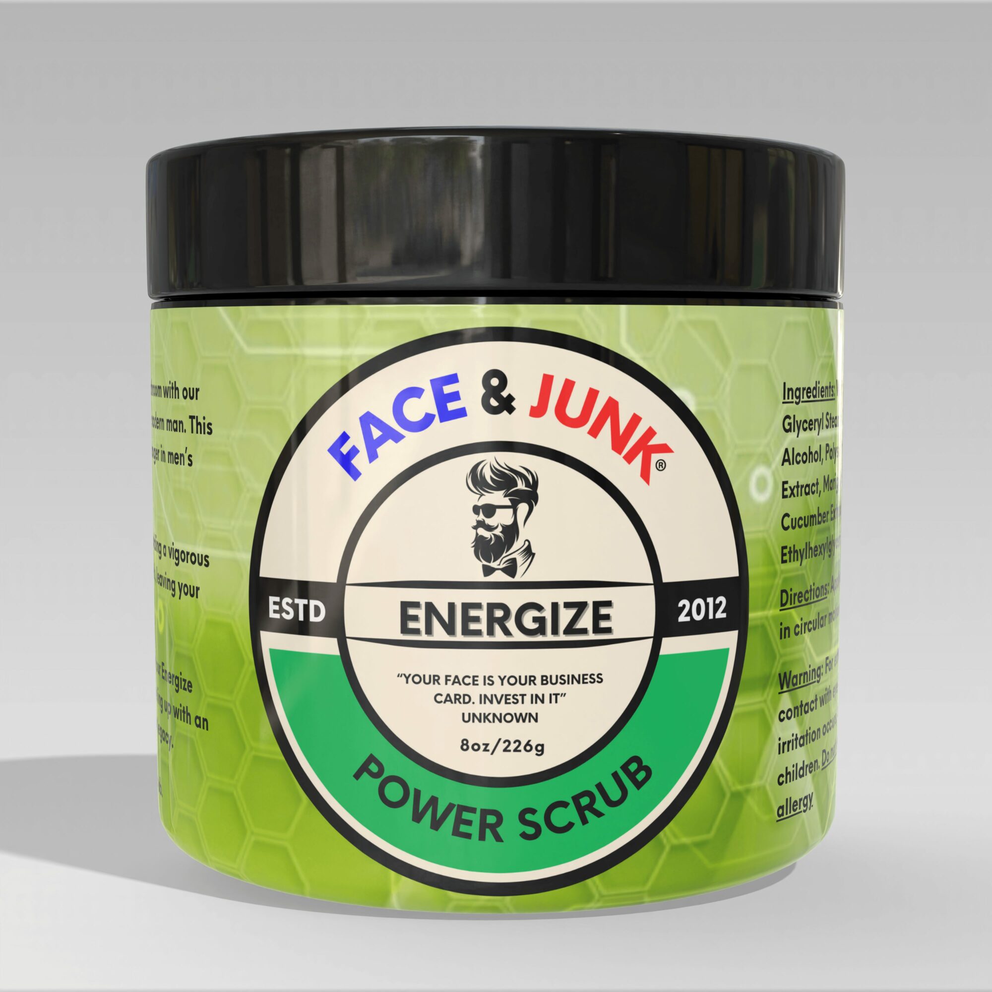 Green container labeled 'Face & Junk Power Scrub' with black lid, logo, and text, on a gray background.