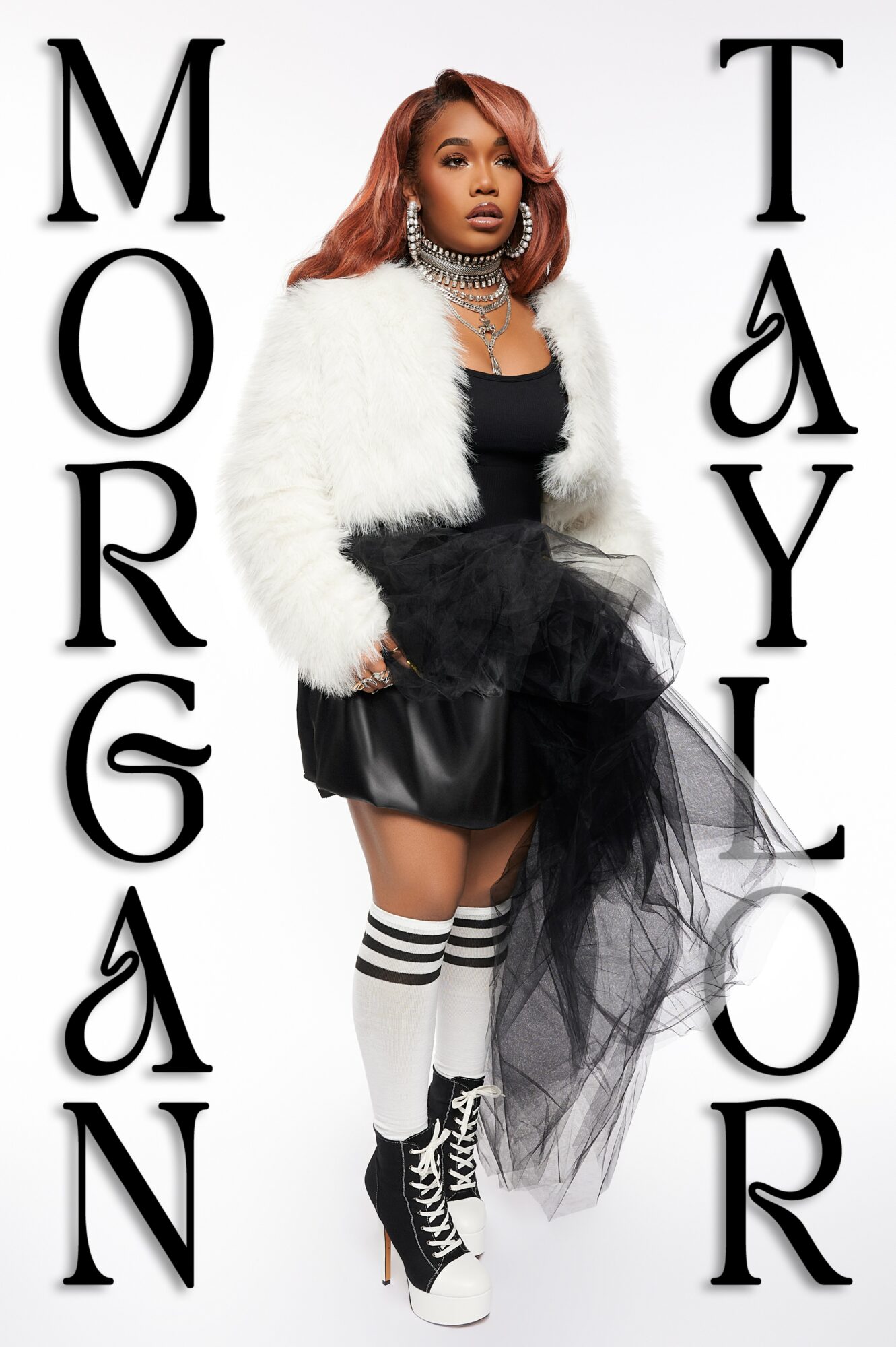 Woman in black and white outfit with fluffy jacket, tulle skirt, and striped socks, standing between text reading 'MORGAN' and 'TAYLOR'.