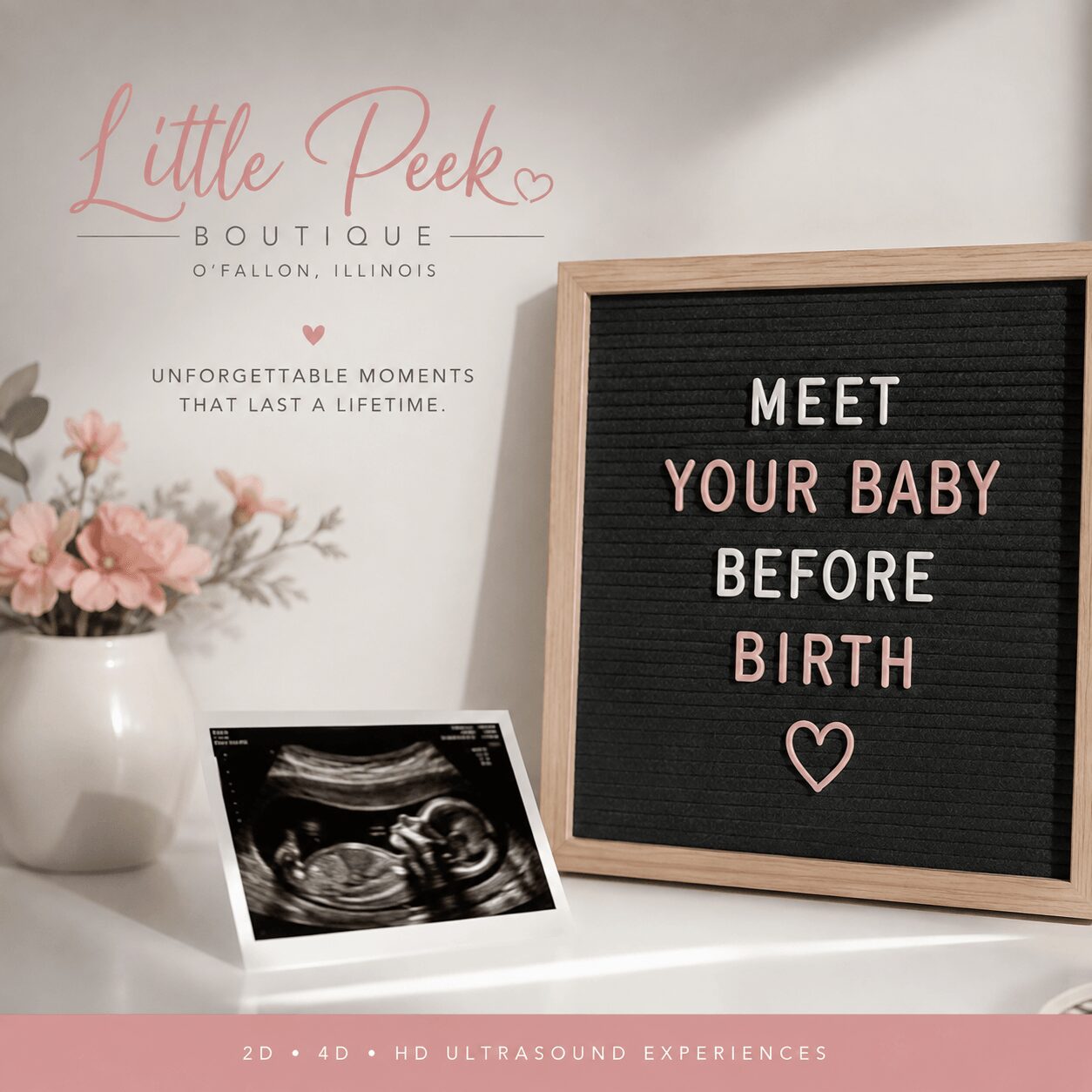 Decorative sign with the message 'Meet your baby before birth' and an ultrasound image on a white surface.
