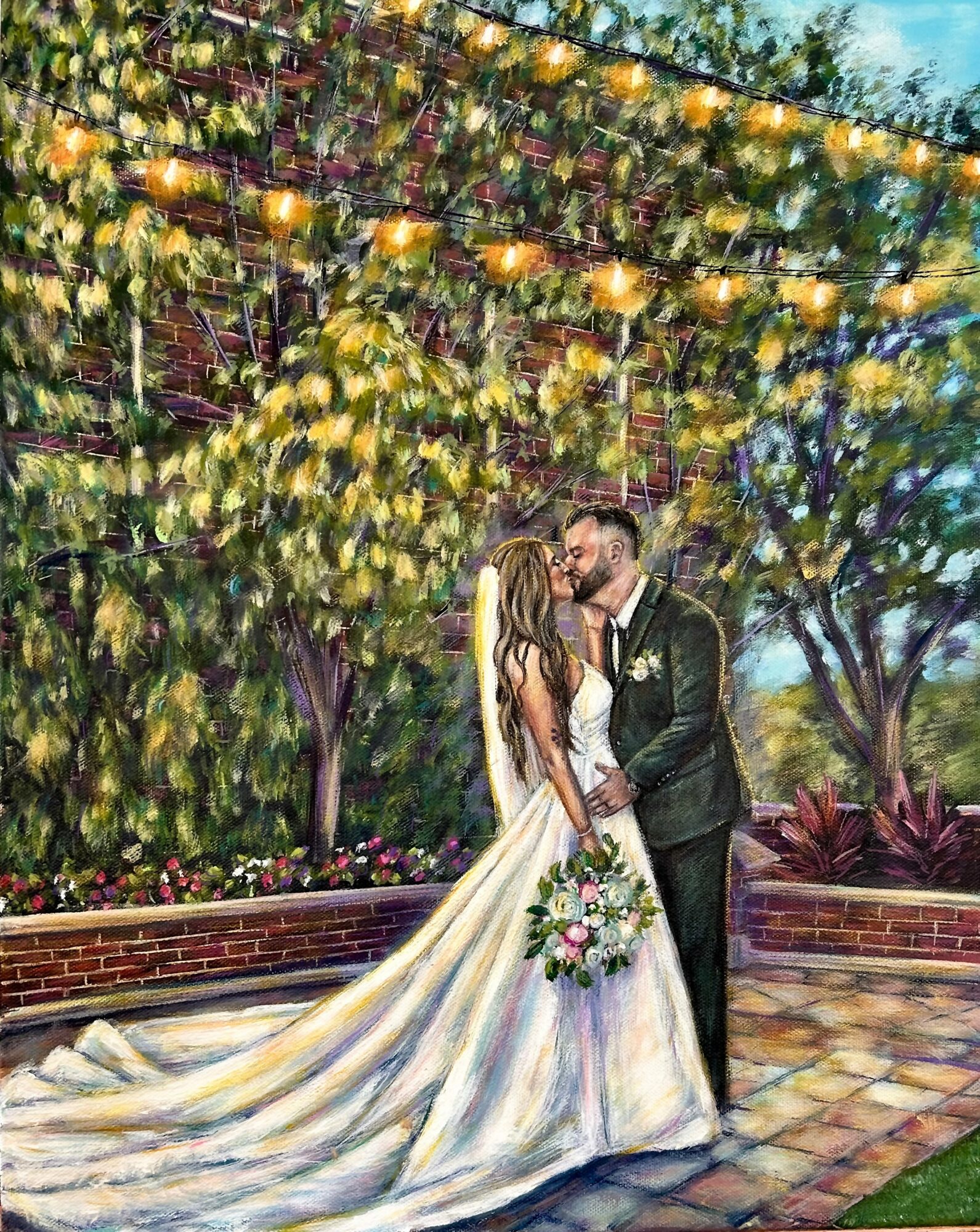 A bride and groom kiss outdoors under string lights and trees, with the bride holding a bouquet, wedding dress flowing.