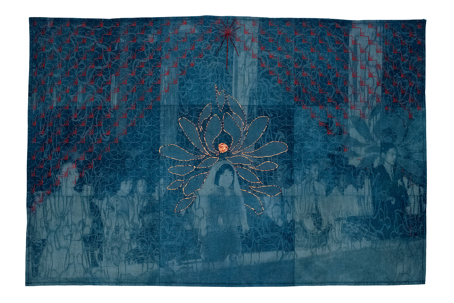 Blue fabric with floral patterns and a central flower design, possibly a decorative textile or curtain.